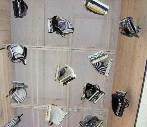 play an accordion...